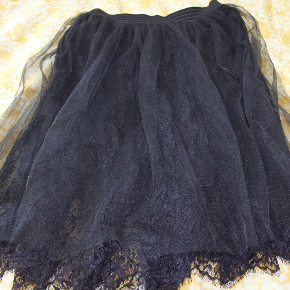 Mid length lace midi skirt with tile overlay and elastic waistband